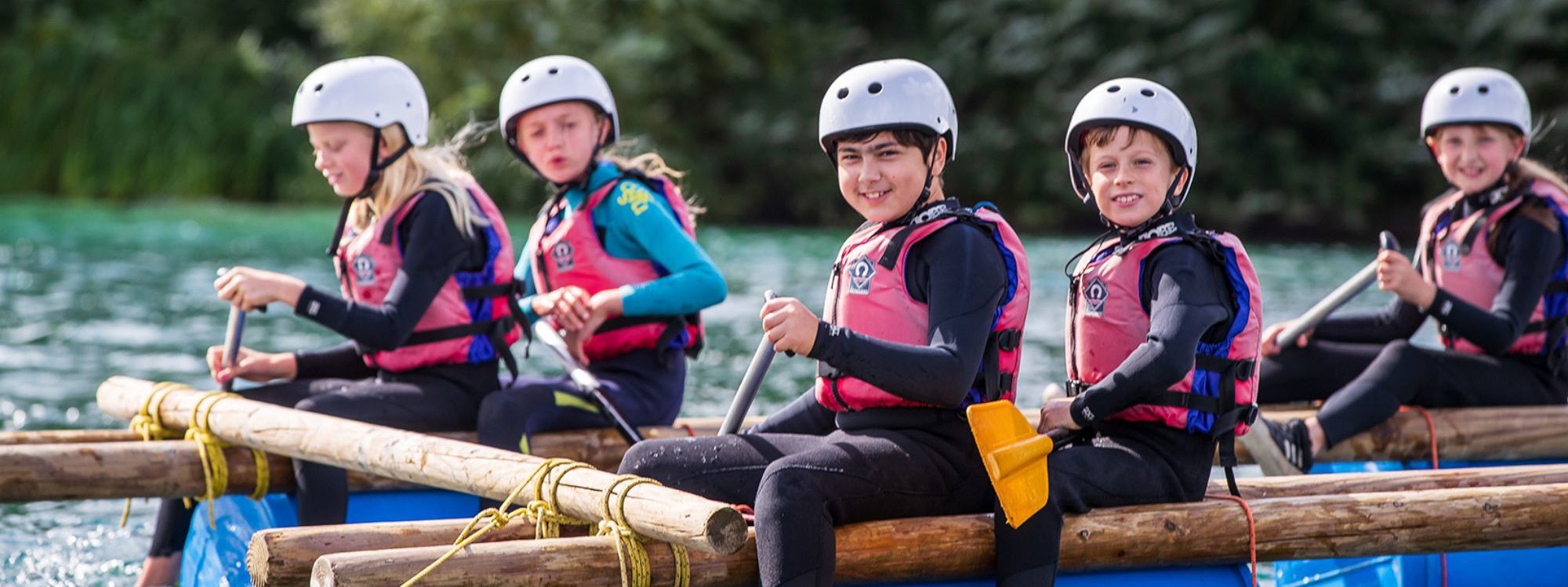 Group of children on a raft in Willen Lake