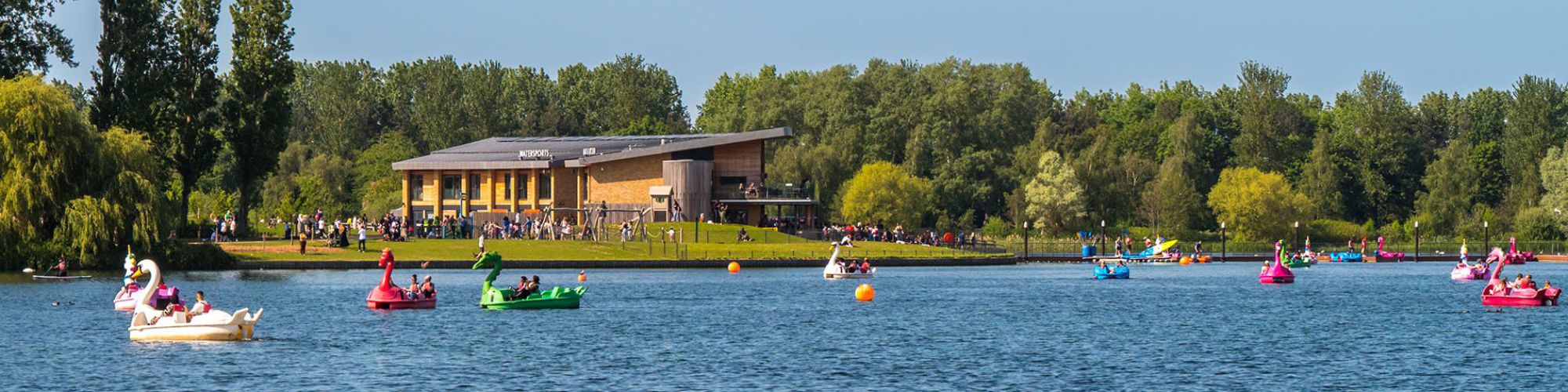 Willen Lake with pedalos and activities with Watersports Centre in background