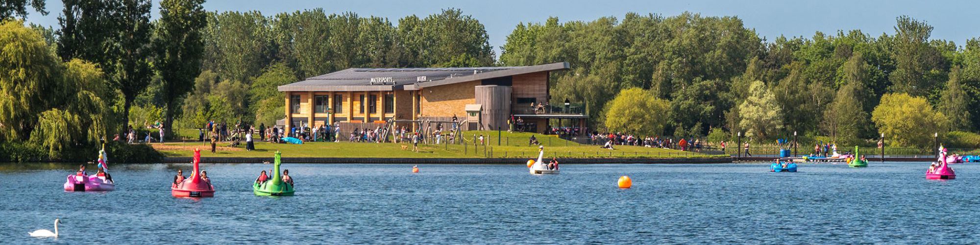 Willen Lake with pedalos and activities with Watersports Centre in distance