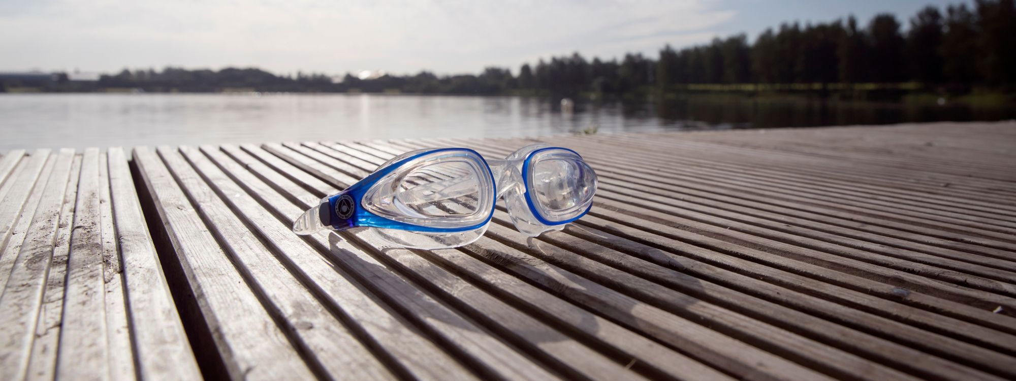 Goggles on pontoon with lake in the background