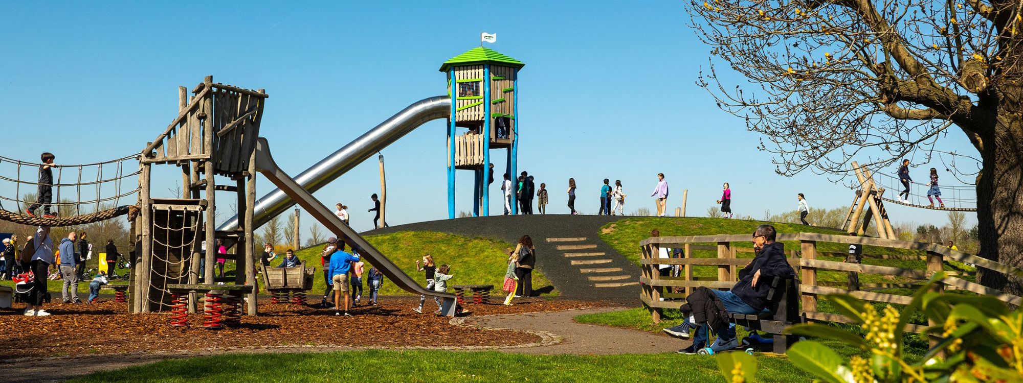 Families playing on the playground at Willen Lake